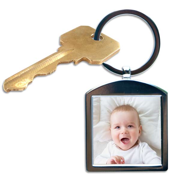 Keep your favorite snapshot close with our personalized silver photo keychain.